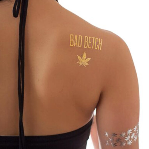 Metallic tattoo displayed on back shoulder and hand